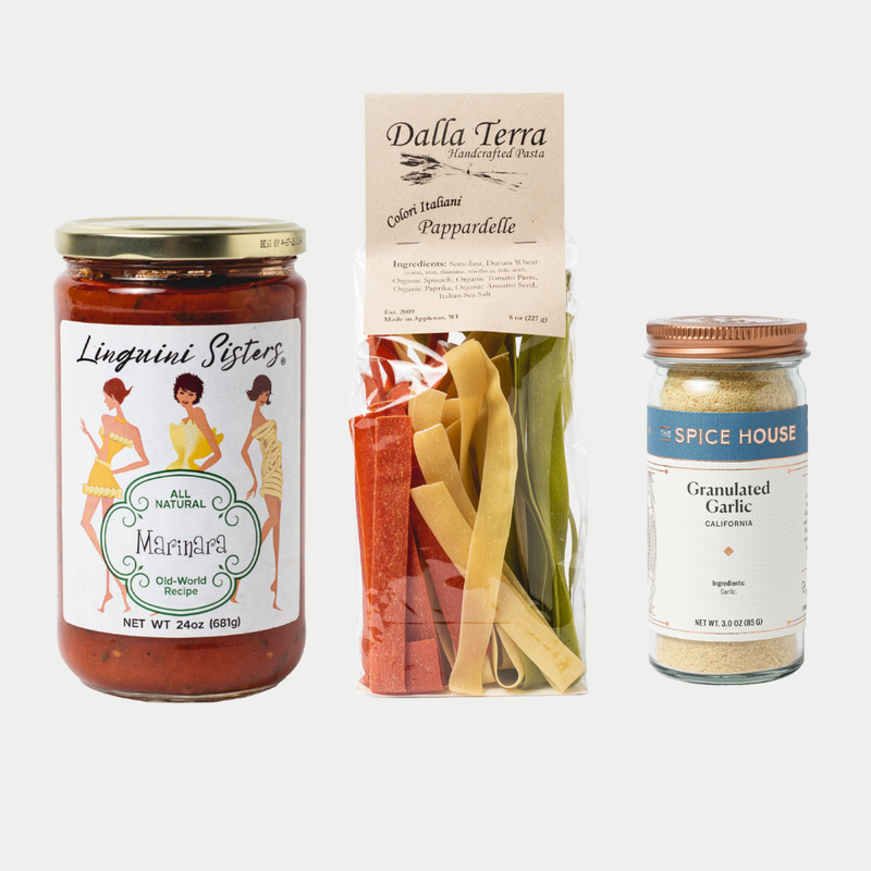 Three food products including a jar of marinara sauce, a package of pasta, and a container of garlic on a white background.